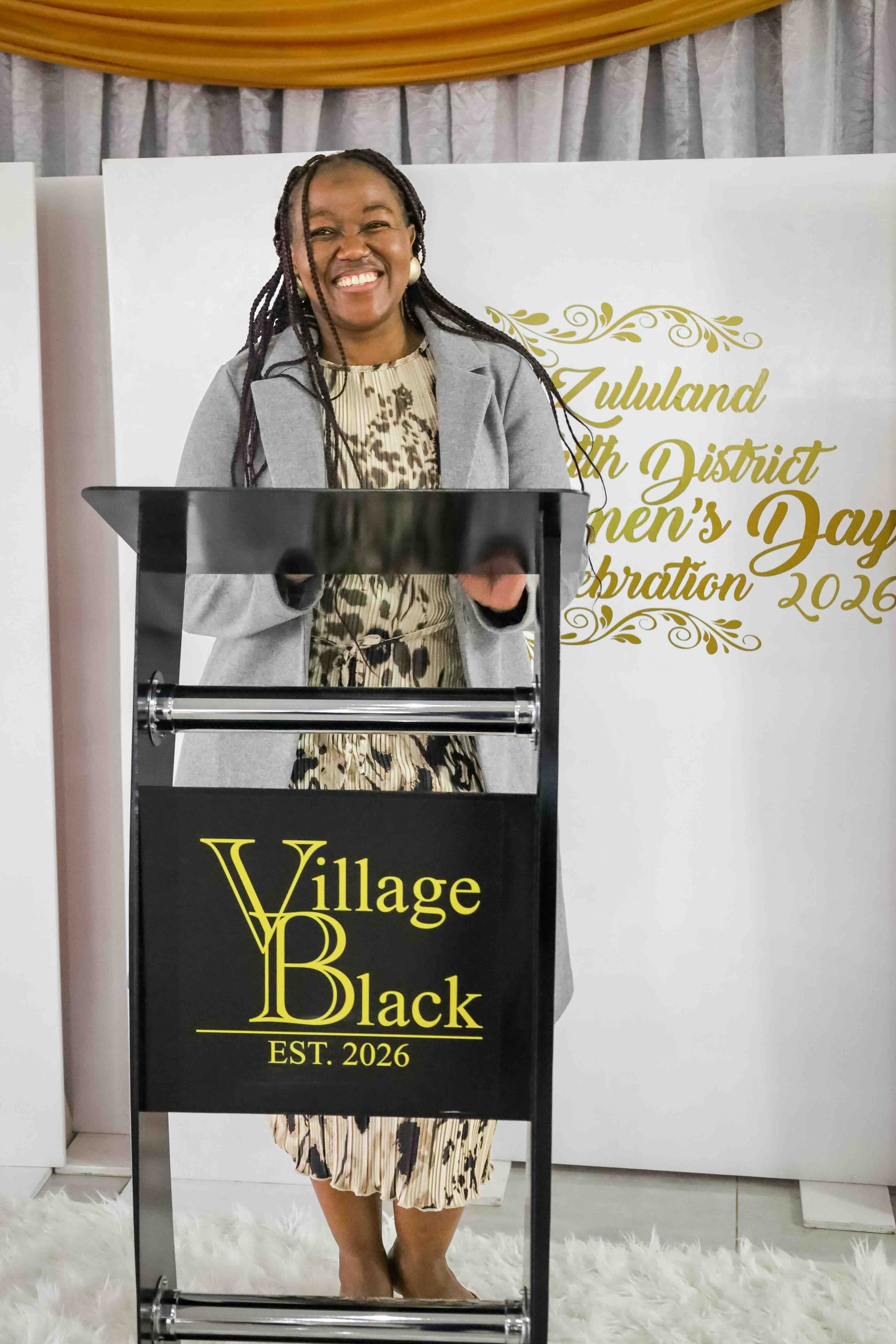 Speaker at the Village Black lectern